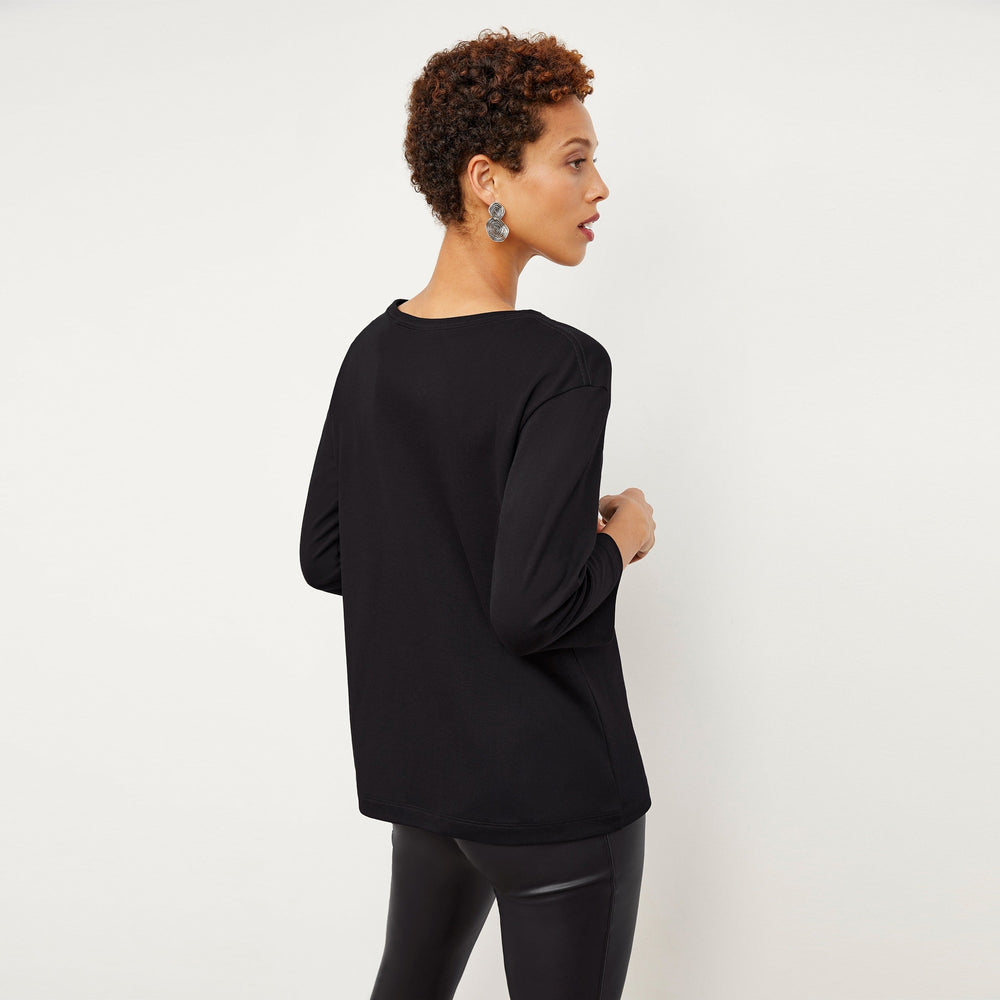 Back image of a woman wearing the Owen T-Shirt in Black