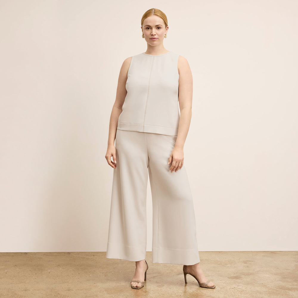 front image of a woman wearing the elena pant in eggshell