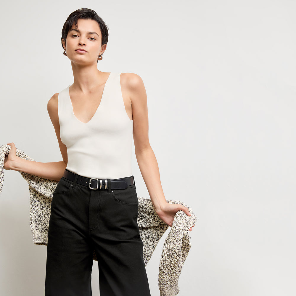 front image of a woman wearing the alecia top in ivory
