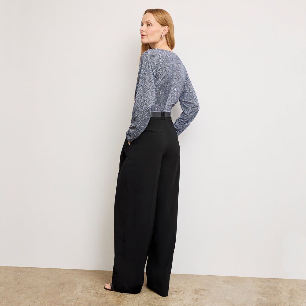 Back image of a woman wearing the amina top in blueprint sketch