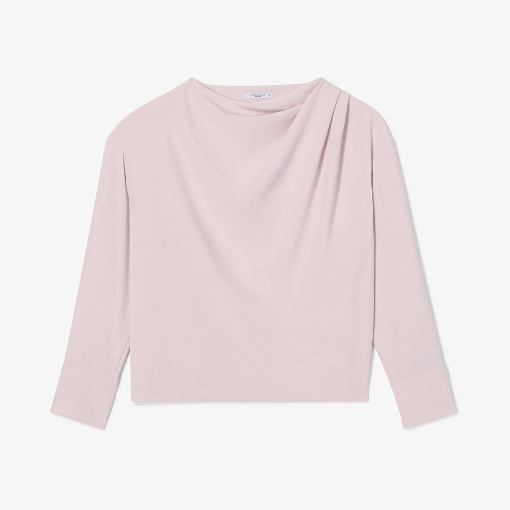 Pink long-sleeve top on a light gray background
