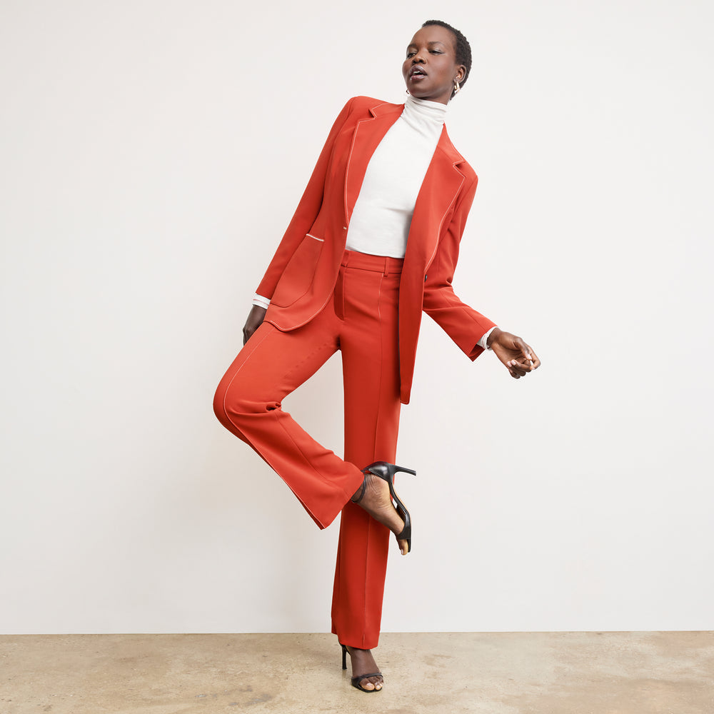 front image of a woman wearing the athena blazer in ginger with topstitch