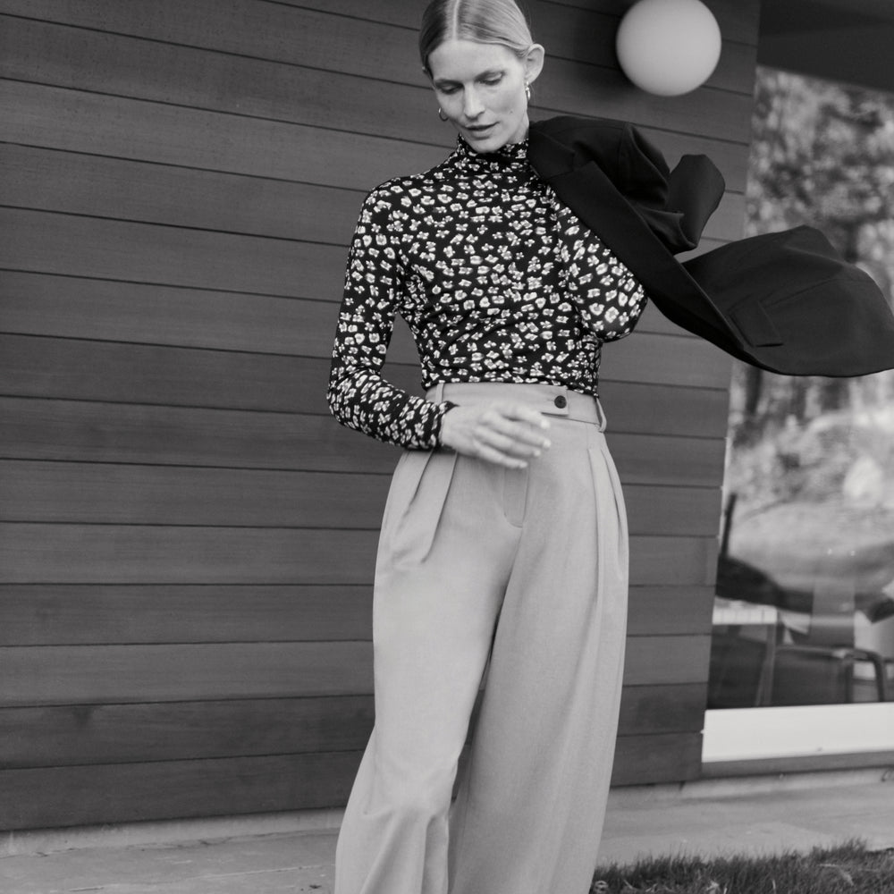 front image of a woman wearing the axam top in kaleidoscope print