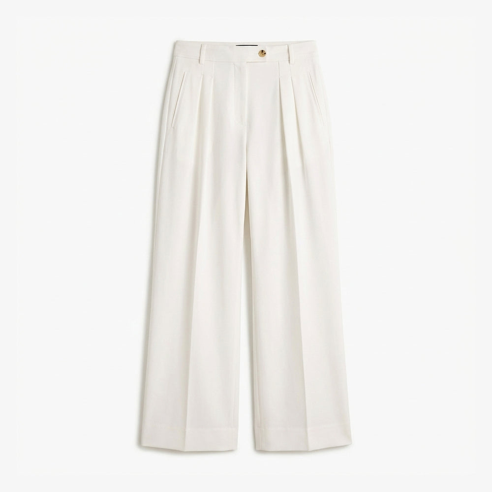 White wide-leg pants on a light beige background