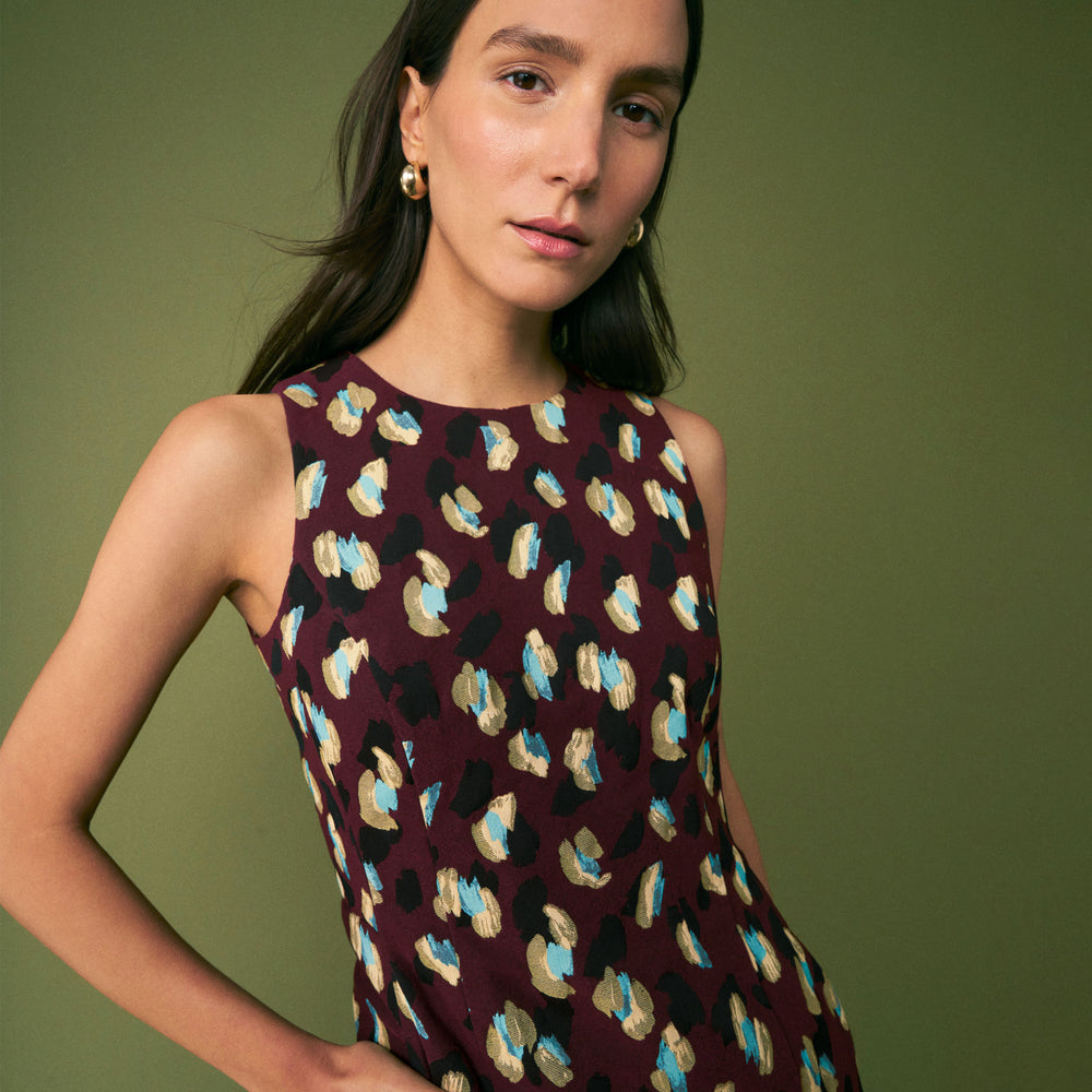 mood image of a woman wearing the constance dress in bengal jacquard