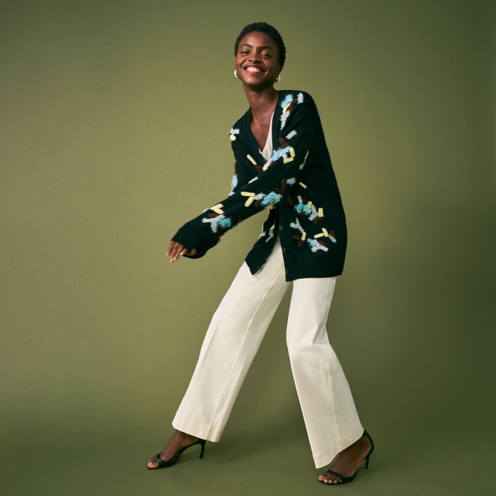 mood image of a woman wearing the cookie cardigan in confetti