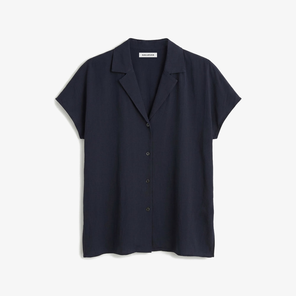 Navy short-sleeve shirt on a light gray background