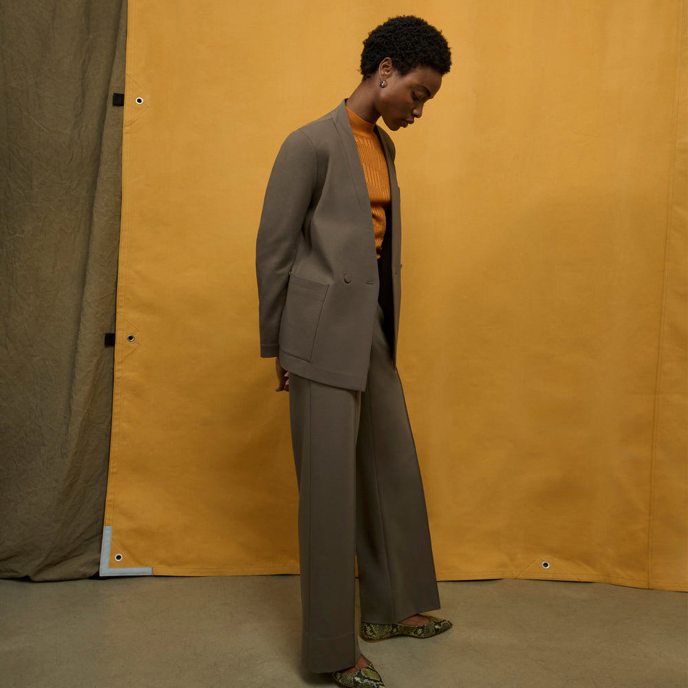 front image of a woman wearing the janette jacket in ash