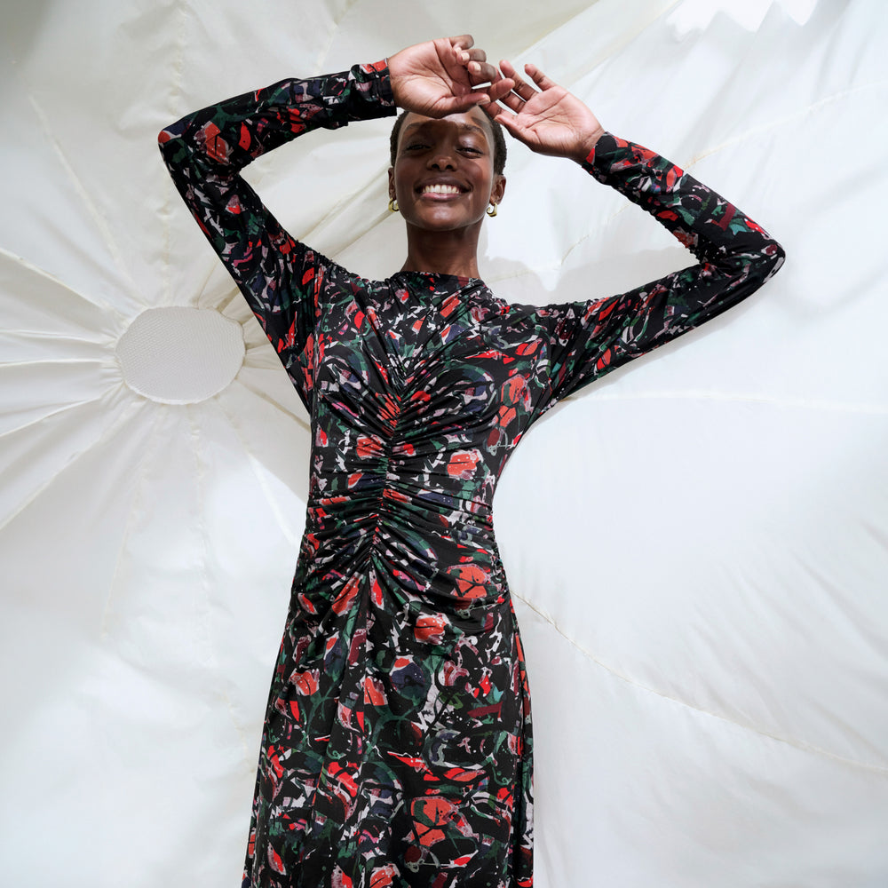 front image of a woman wearing the johnna dress in splatter pop