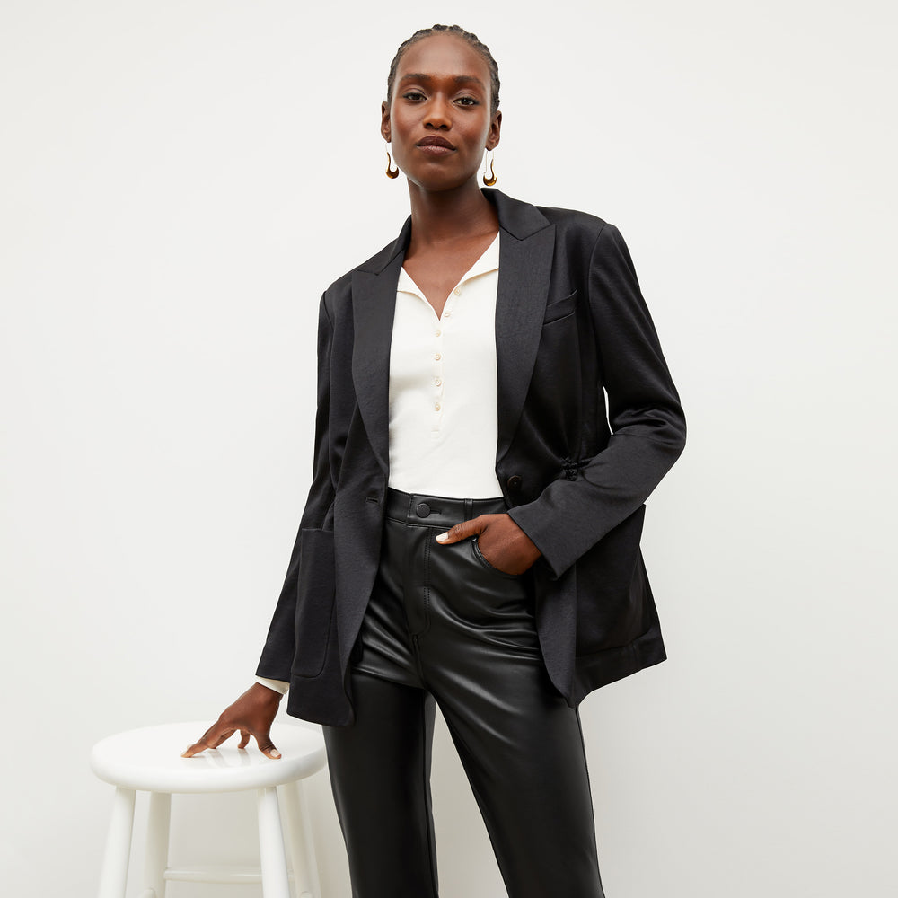 Image of a woman wearing the Hyo Jacket in Black