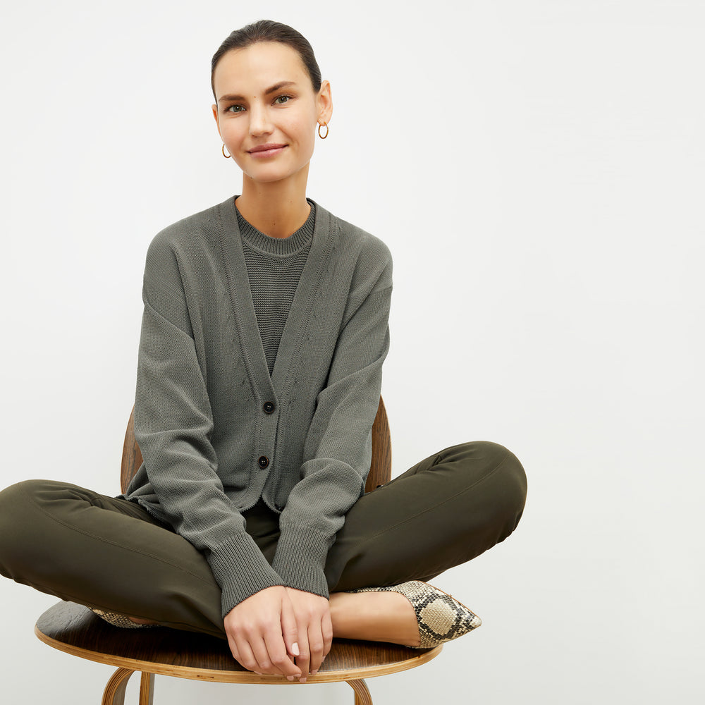 front image of a woman wearing the cookie cardigan in fossil