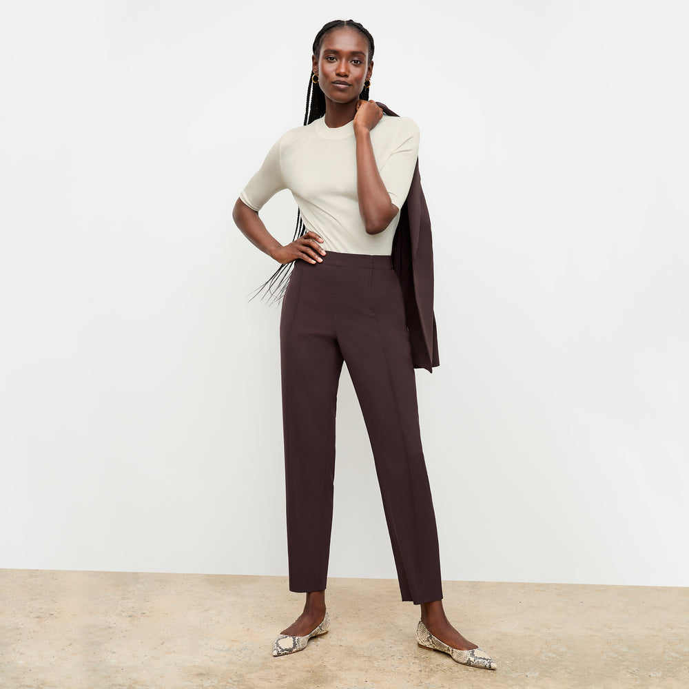 front image of a woman wearing the moreland jacket in wine over her shoulder