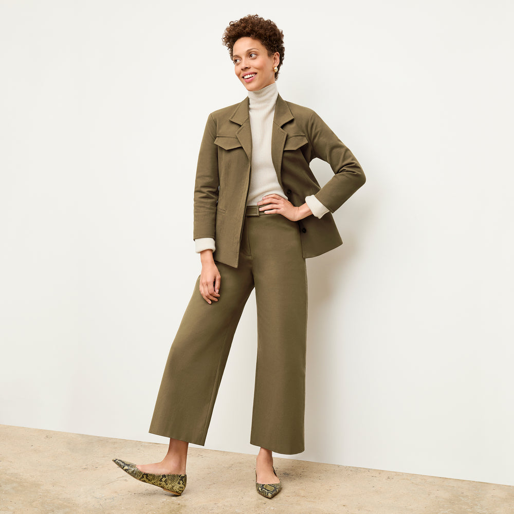 front image of a woman wearing the abby pant in oregano