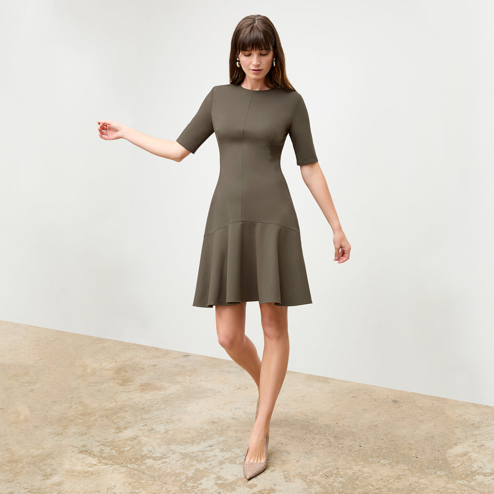 front image of a woman wearing the gina dress in ash