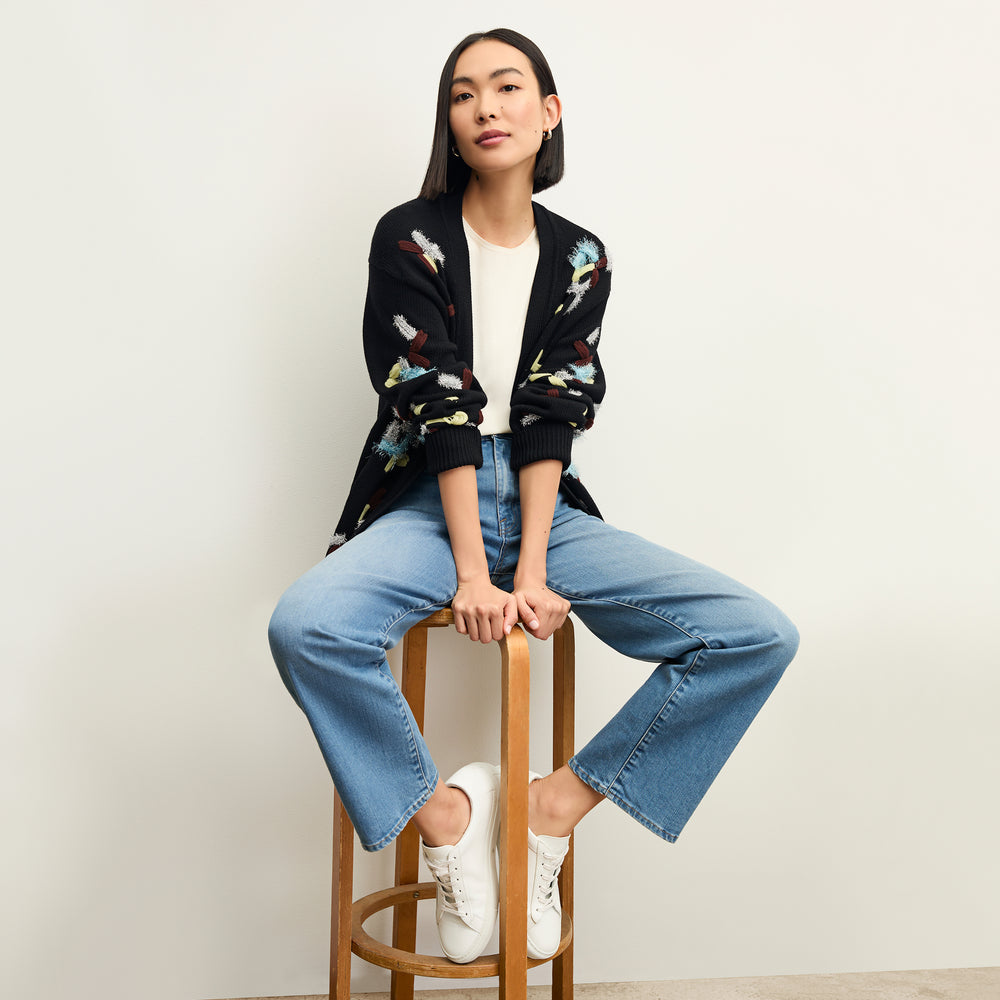 front image of a woman wearing the cookie cardigan in confetti