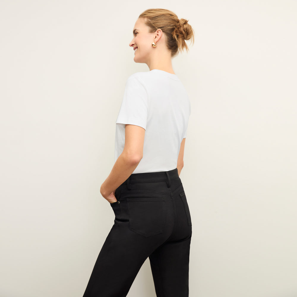 back image of a woman wearing the Lee T-Shirt in White