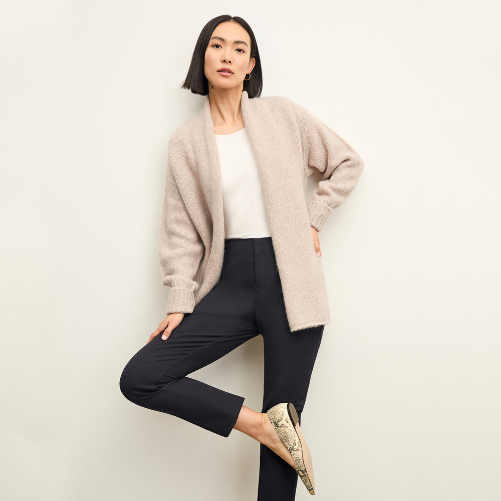front image of a woman wearing the frederick cardigan in Walnut
