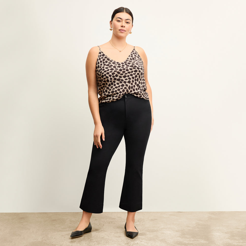 Front image of a woman standing wearing the Lisey Cami—Sahara Print Washable Silk in Tan/Black