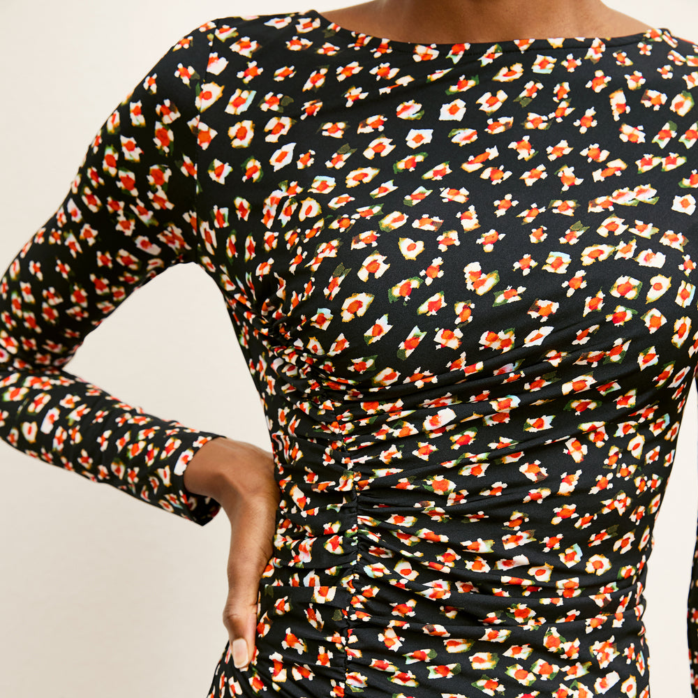 front image of a woman wearing the rani dress in kaleidoscope print