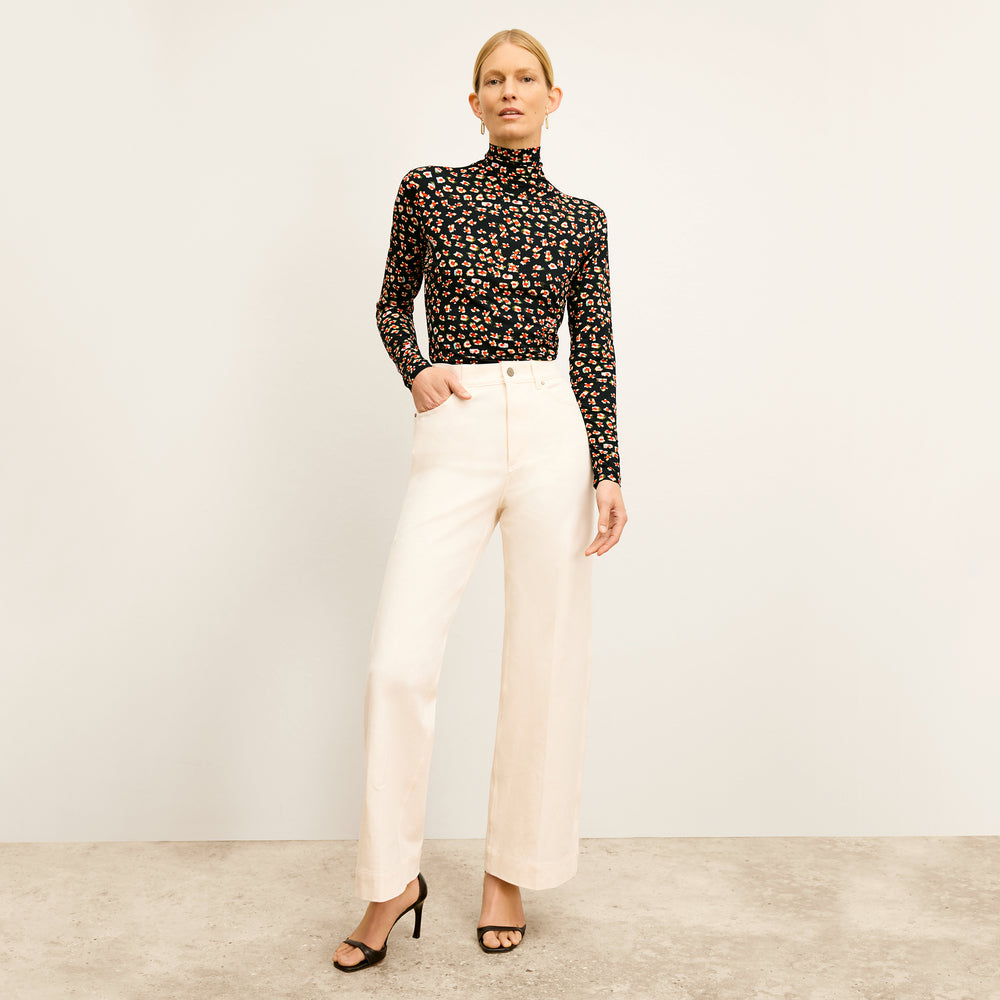 front image of a woman wearing the axam top in kaleidoscope print