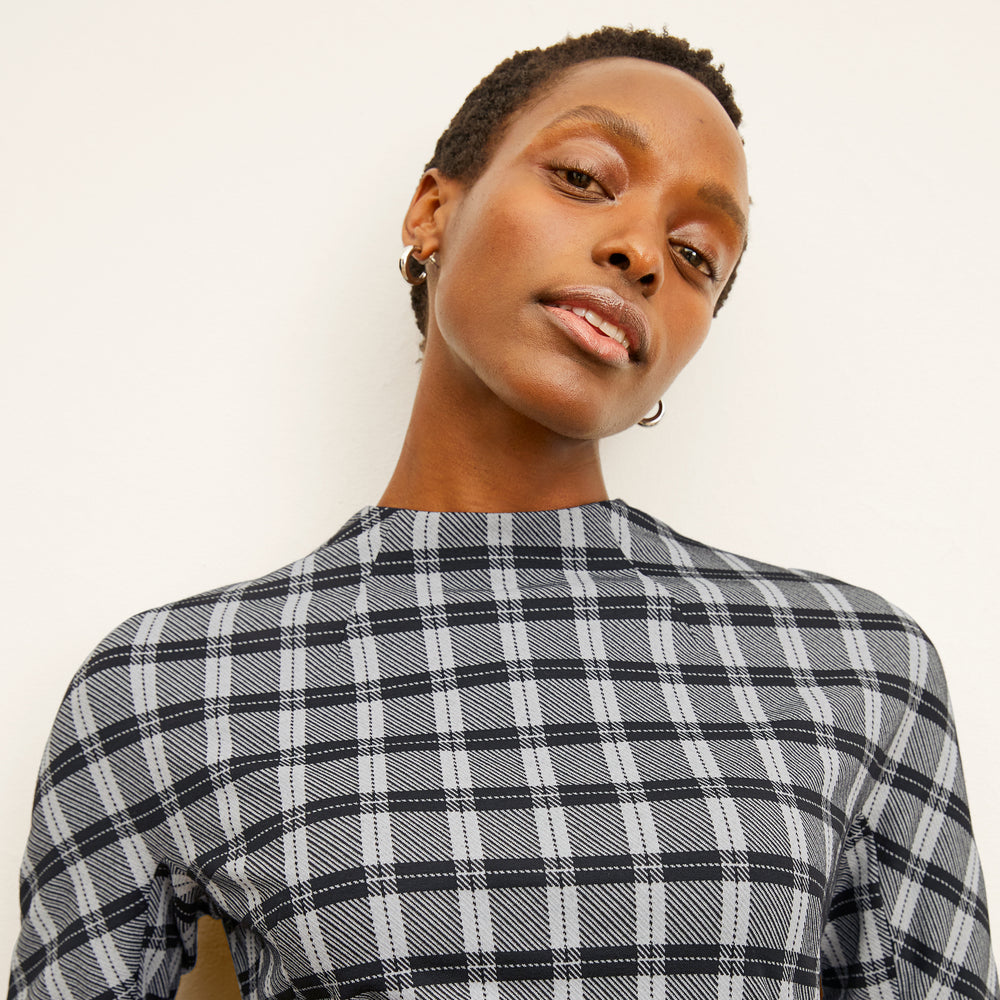front image of a woman wearing the farnoosh dress in checkmate