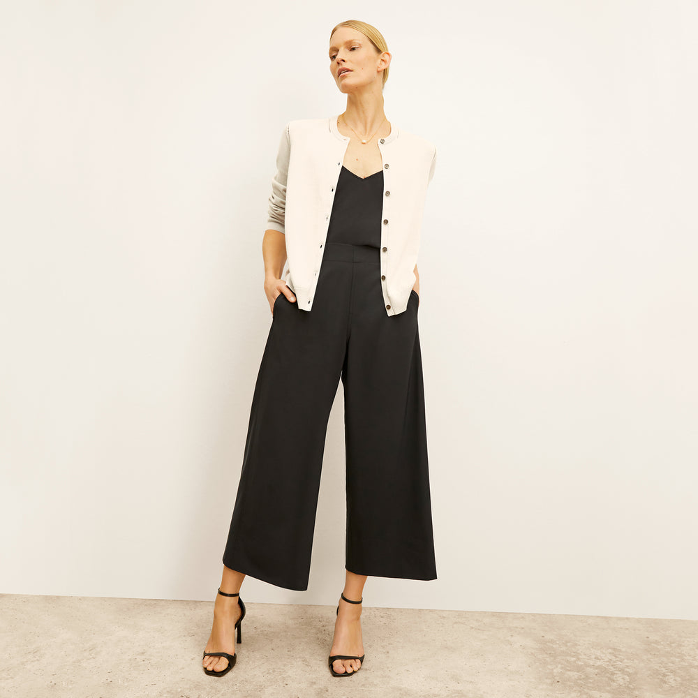 front image of a woman wearing the mel cardigan in ivory
