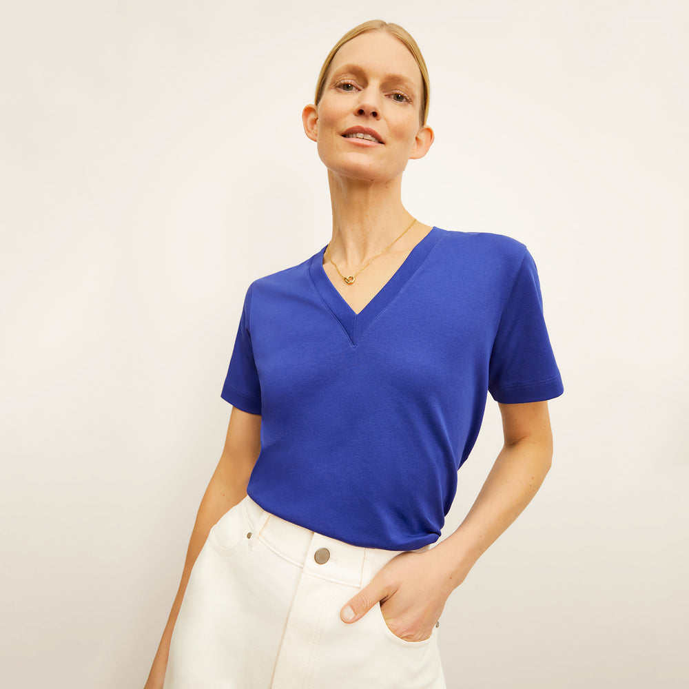 front image of a woman wearing the lee t-shirt in bright indigo