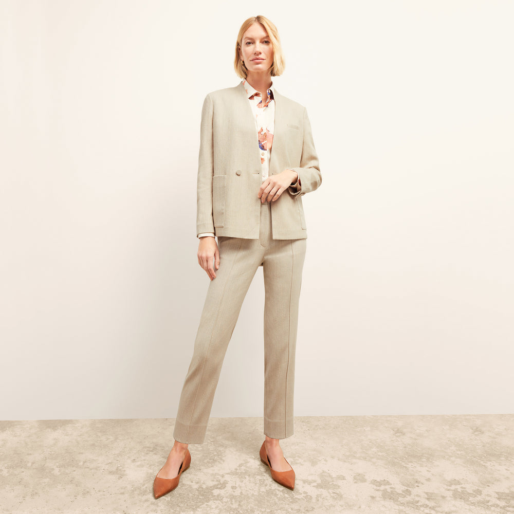 Front image of a woman wearing the Janette Jacket in ivory