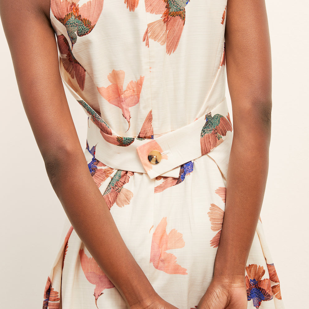 back image of a woman wearing the estela dress in hummingbird print