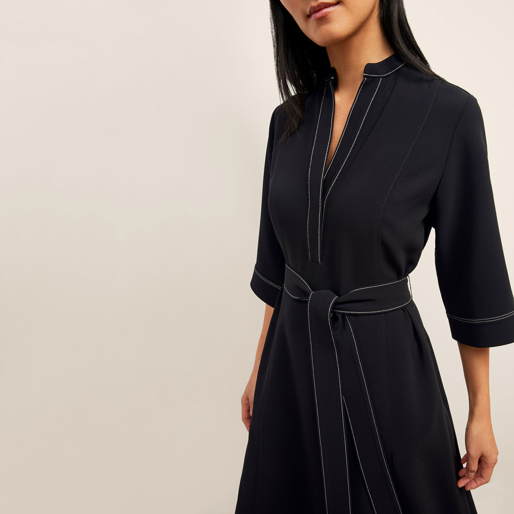 front image of a woman wearing the lauleh dress in black