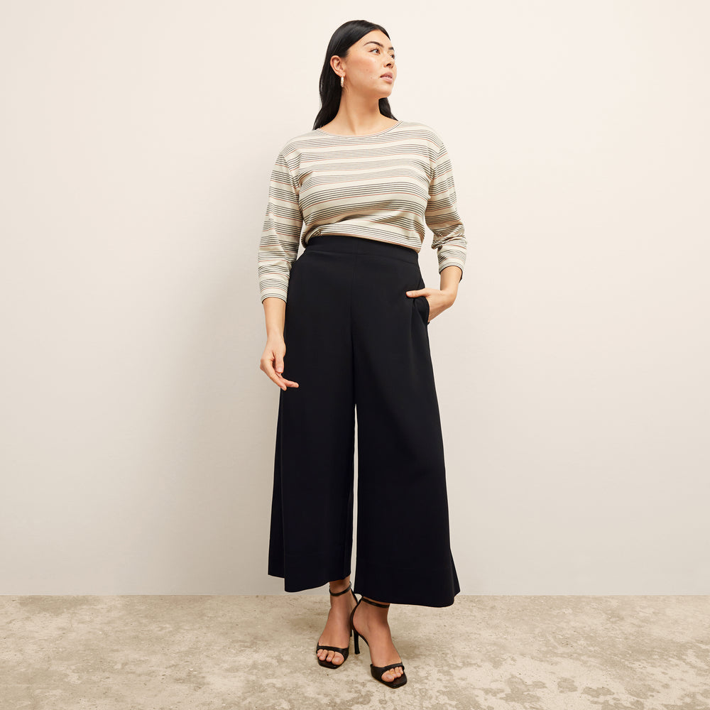front image of a woman wearing the elena pant in black
