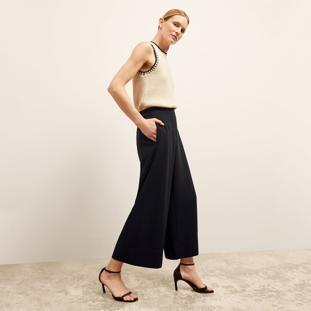 front image of a woman wearing the elena pant in black