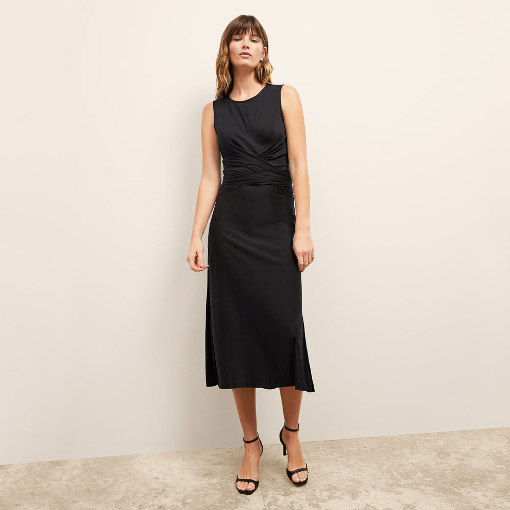 front image of a woman wearing the monte dress in black