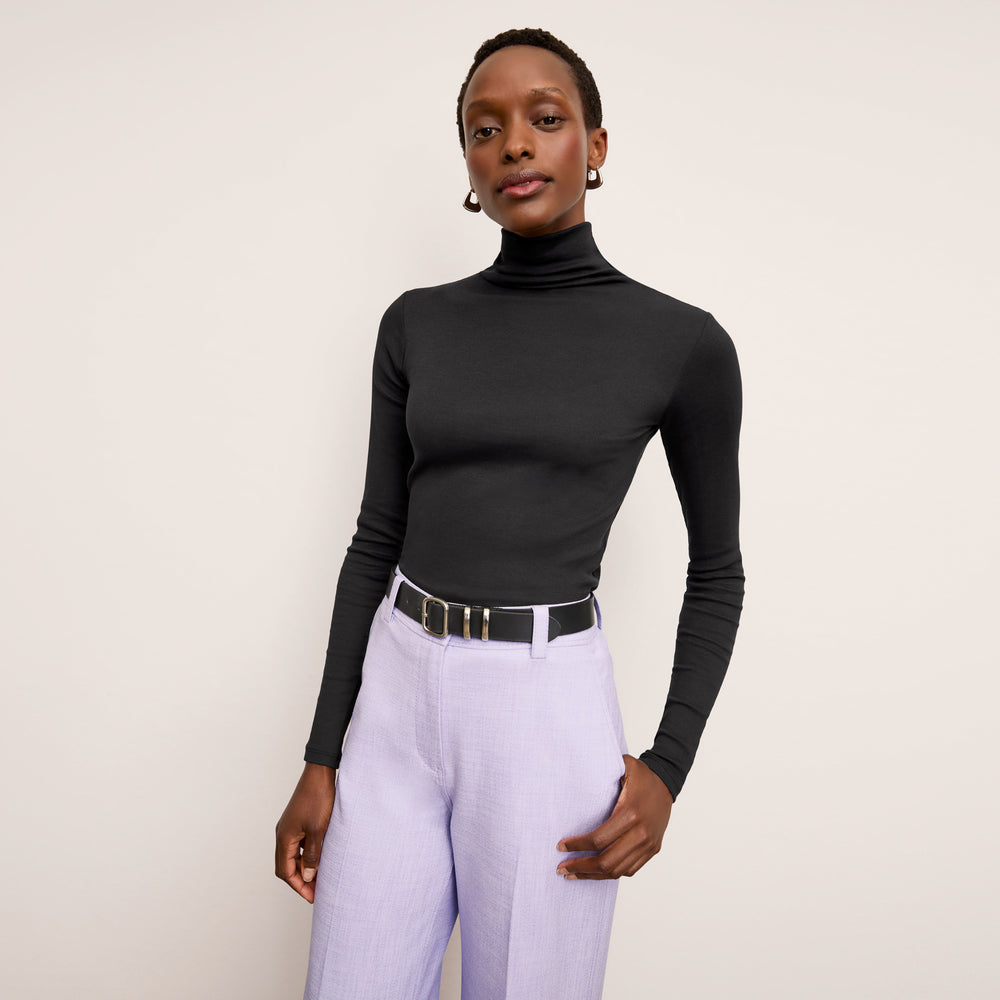front image of a woman wearing the lani pant in lilac/ivory