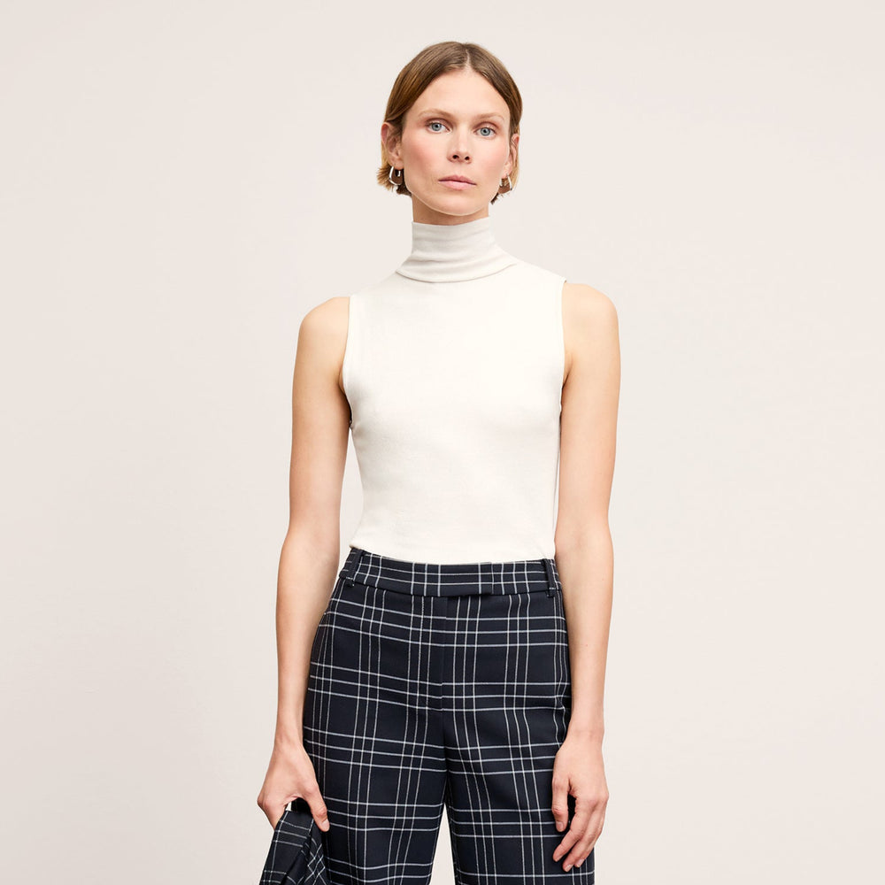 Front image of a woman wearing the Jett Tank in Ivory