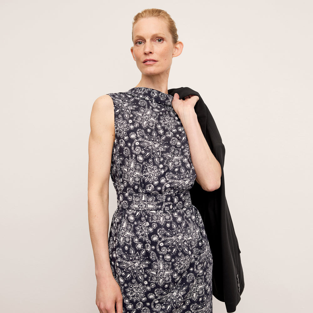 front image of a woman wearing the joslyn dress in kerala print