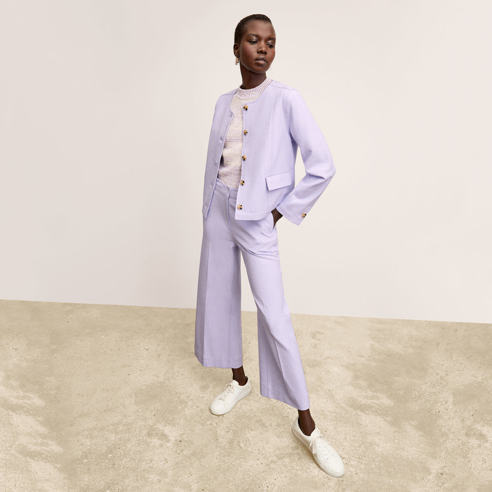 front image of a woman wearing the aniya jacket in lilac/ivory