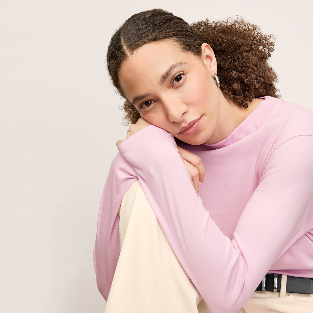 front image of a woman wearing the raquel top in hyacinth