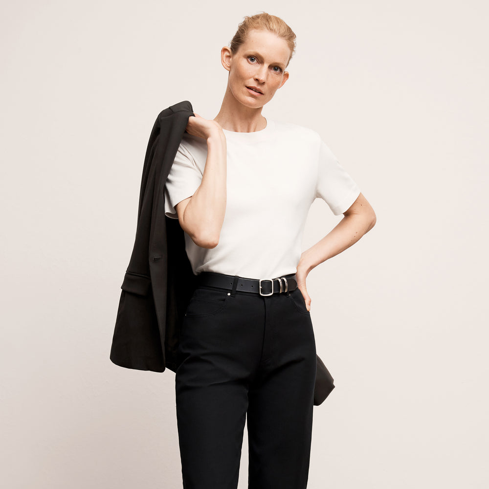 Front image of a woman wearing the leslie top in compact cotton in ivory