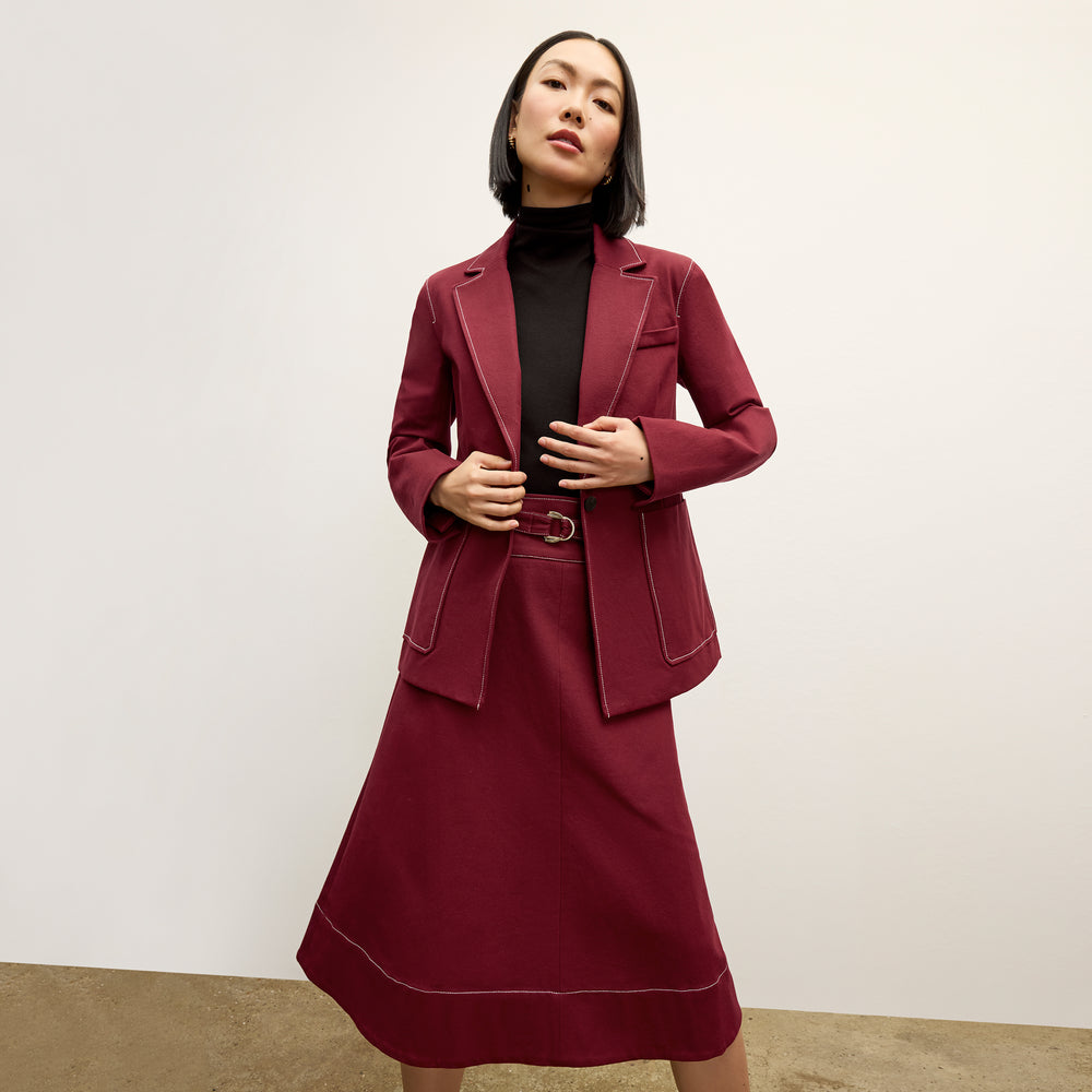 front image of a woman wearing the grenville jacket in berry jam