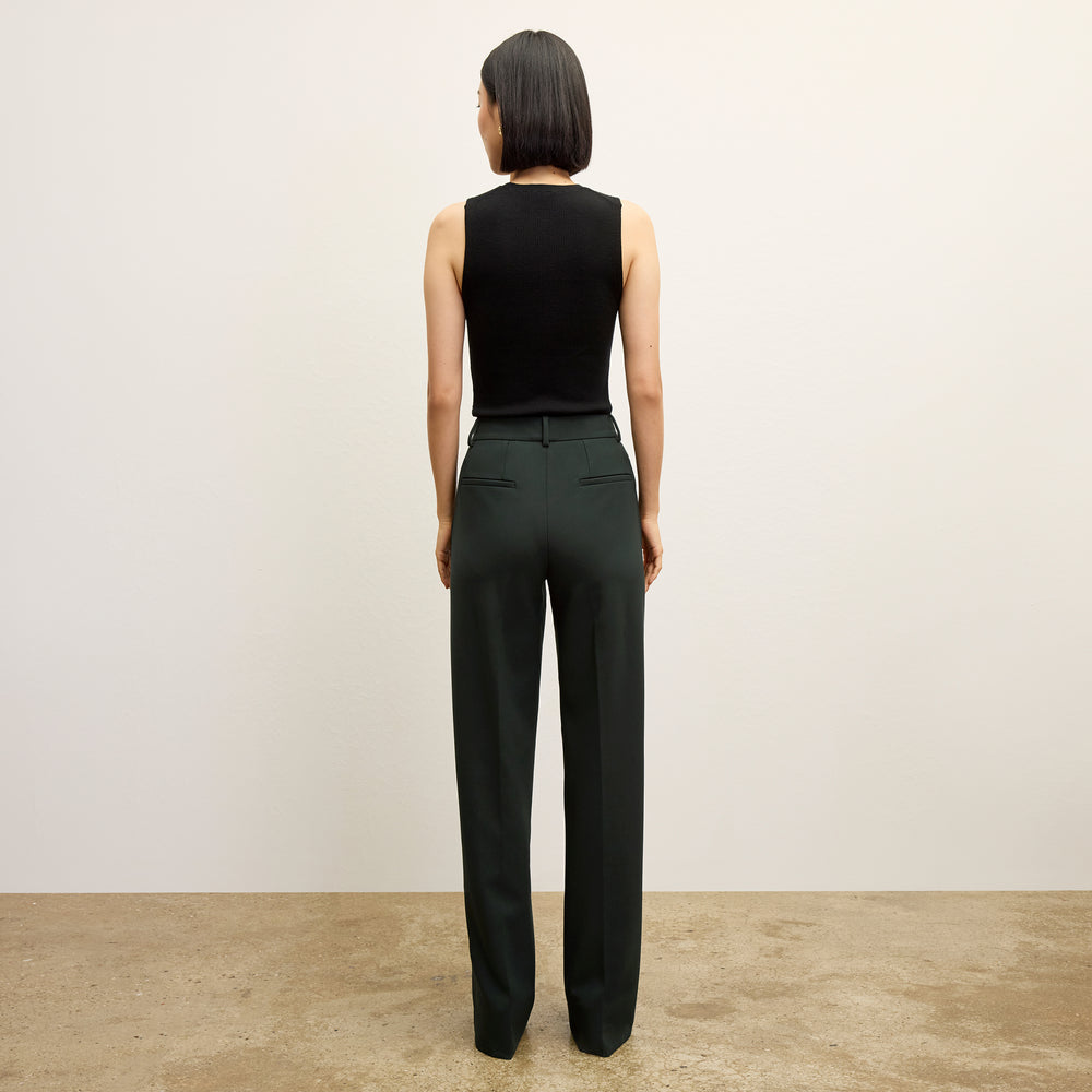 back image of a woman wearing the trina top in black