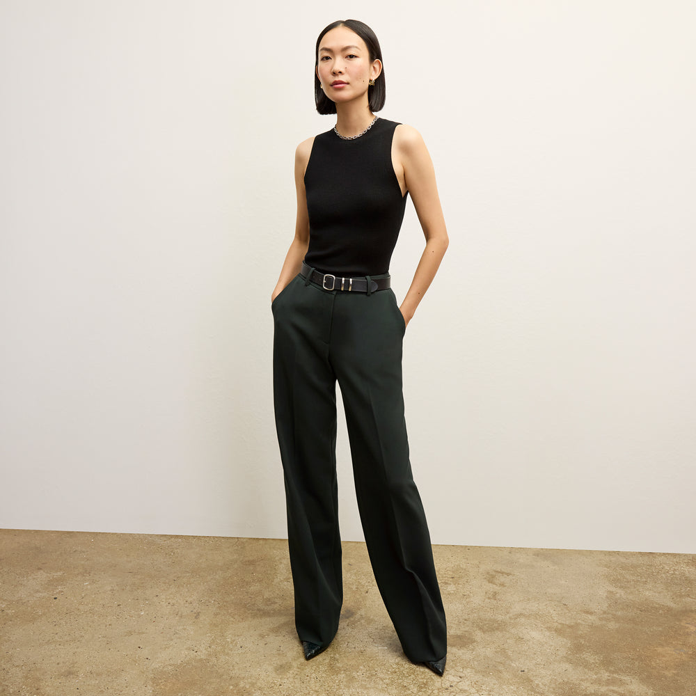 front image of a woman wearing the trina top in black