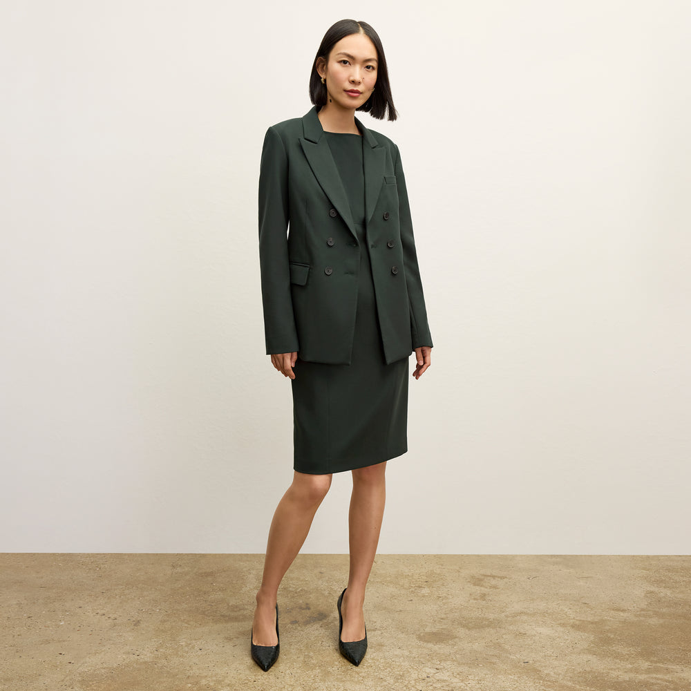 front image of a woman wearing the kati jacket in dark emerald