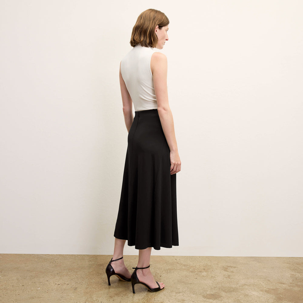 back image of a woman wearing the misty skirt in black