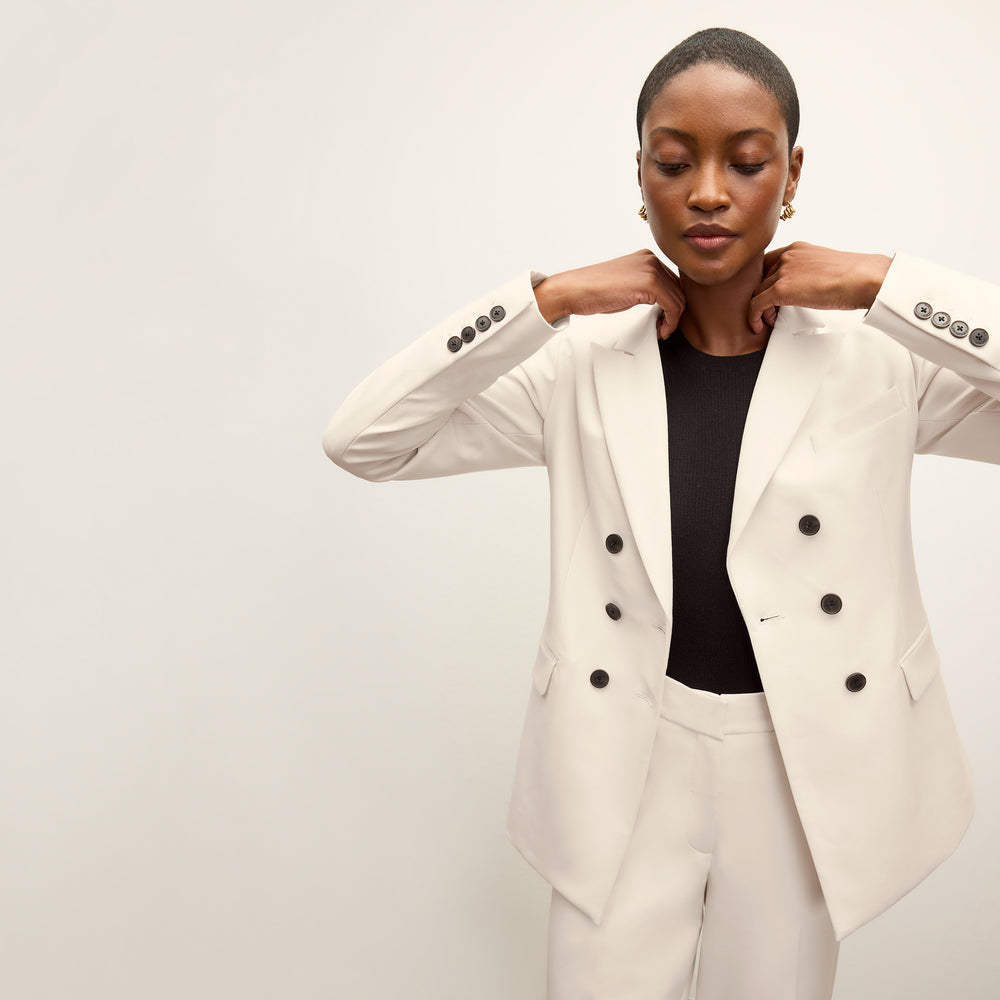 front image of a woman wearing the kati jacket in ivory