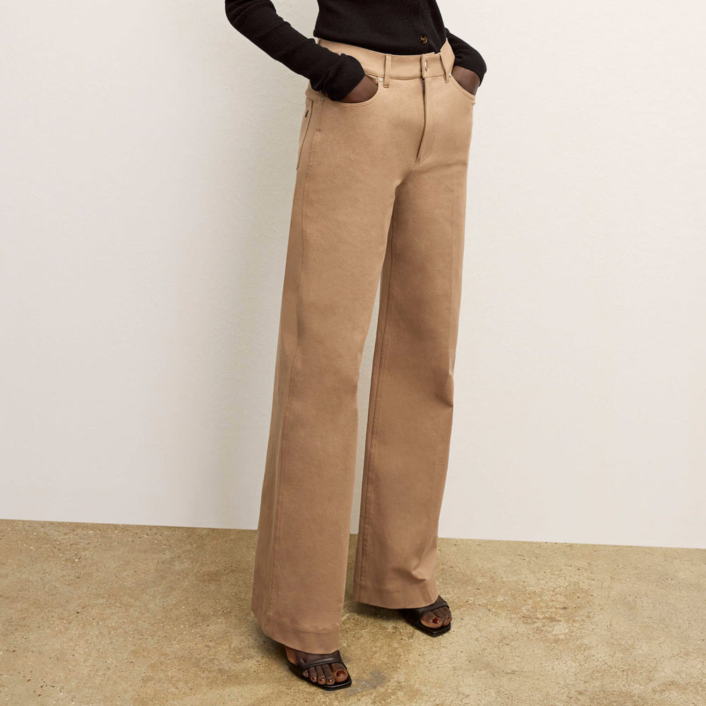 front image of a woman wearing the milo jean in saddle