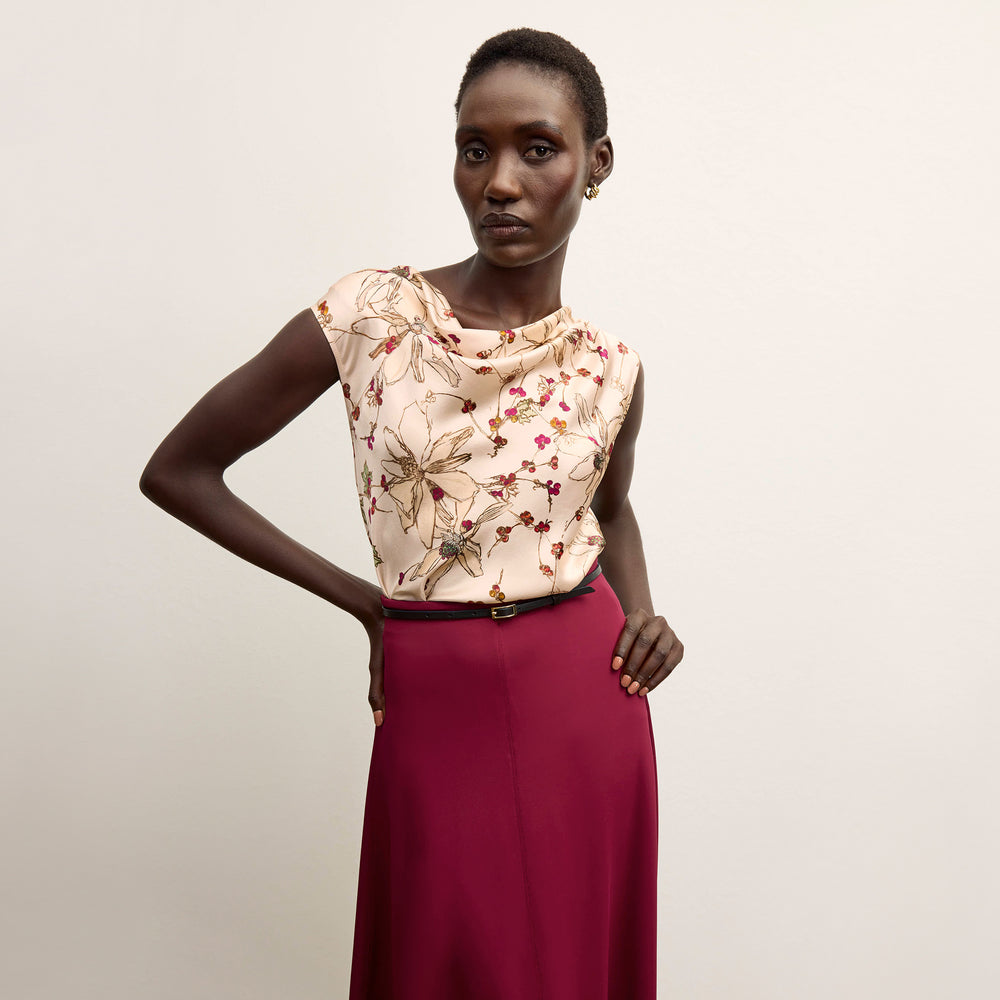 front image of a woman wearing the misty skirt in grenache
