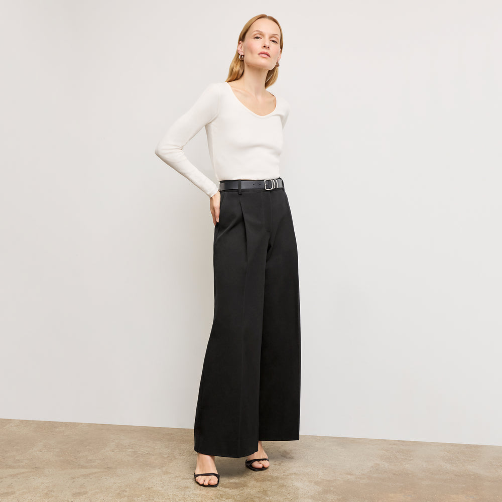 front image of a woman standing wearing the marcia top in fine ribbed cotton in ivory