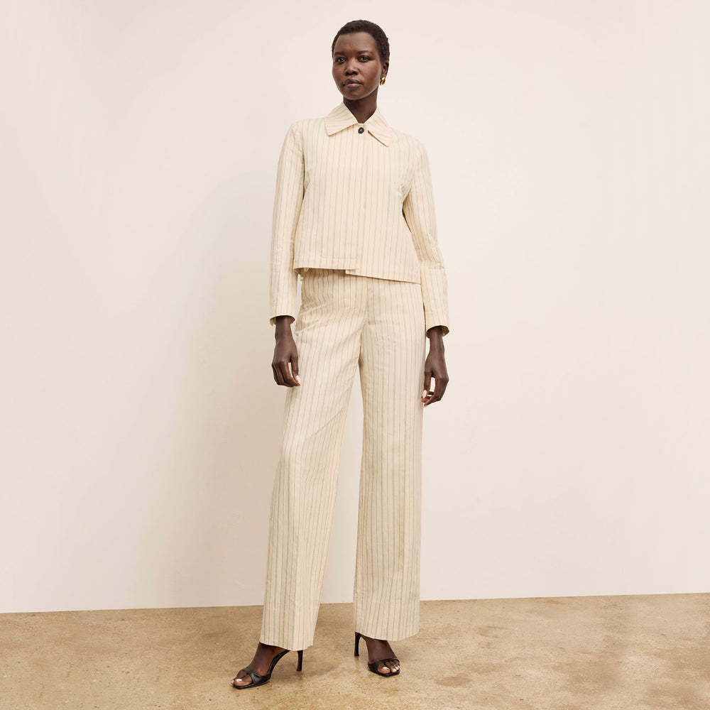 front image of a woman wearing the nicky jacket in linen stripe