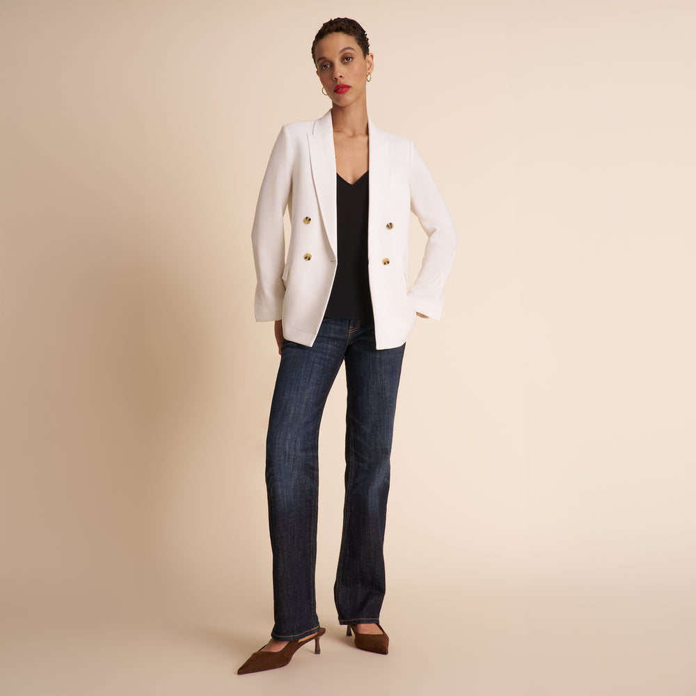 Woman in white blazer.